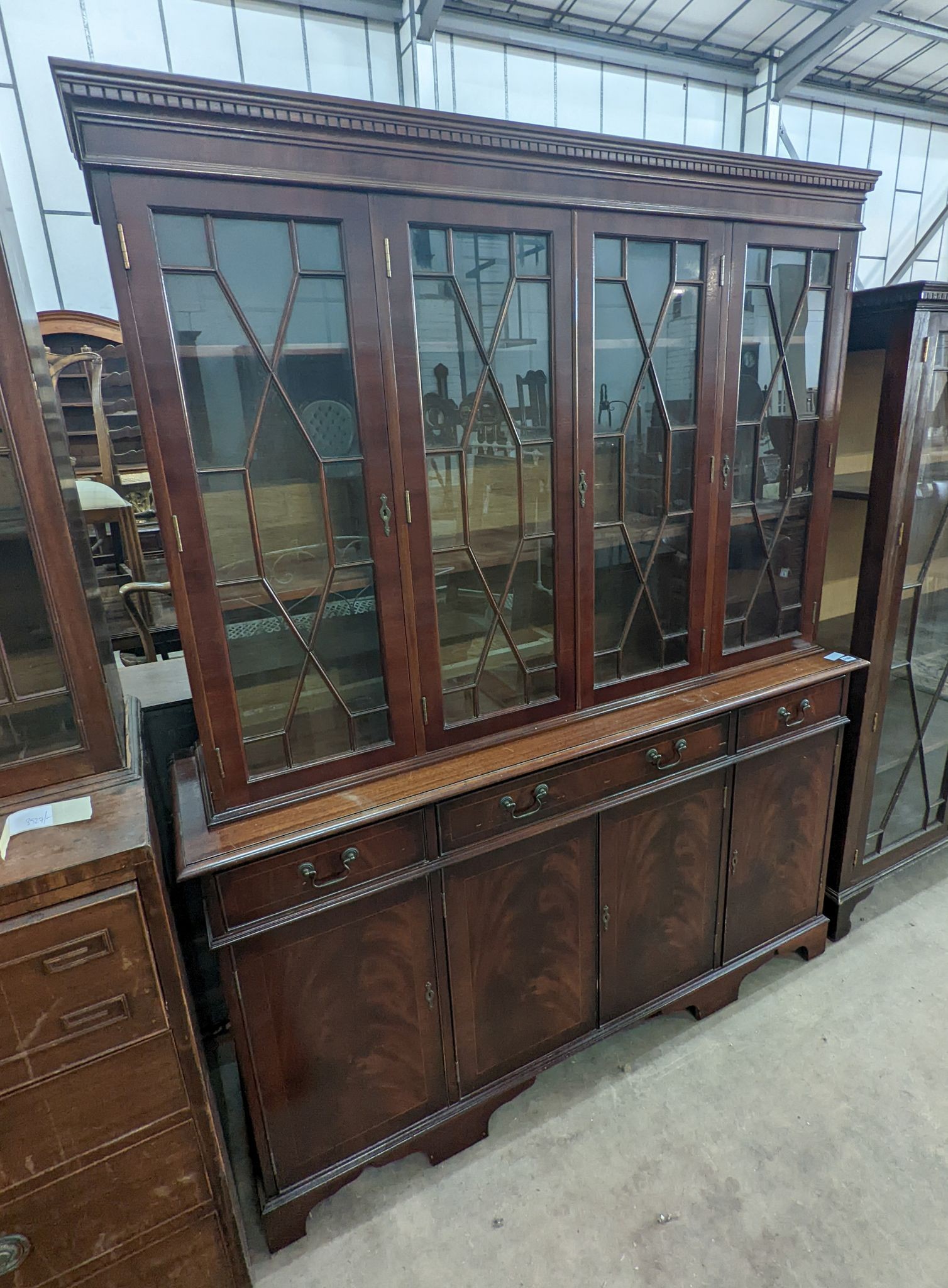 A reproduction George III style mahogany library bookcase, length 154cm, depth 41cm, height 193cm